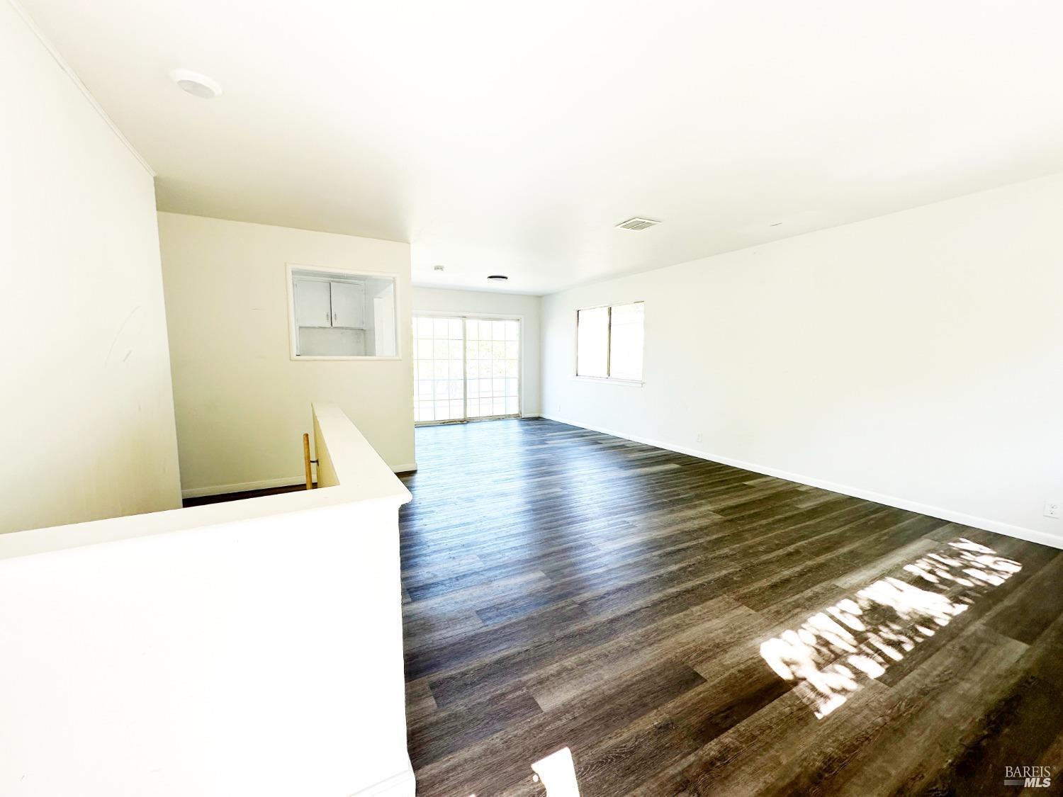 4083 Frye Avenue Clearlake, CA 95422 - Photo 3 of 18 a view of an empty room with wooden floor