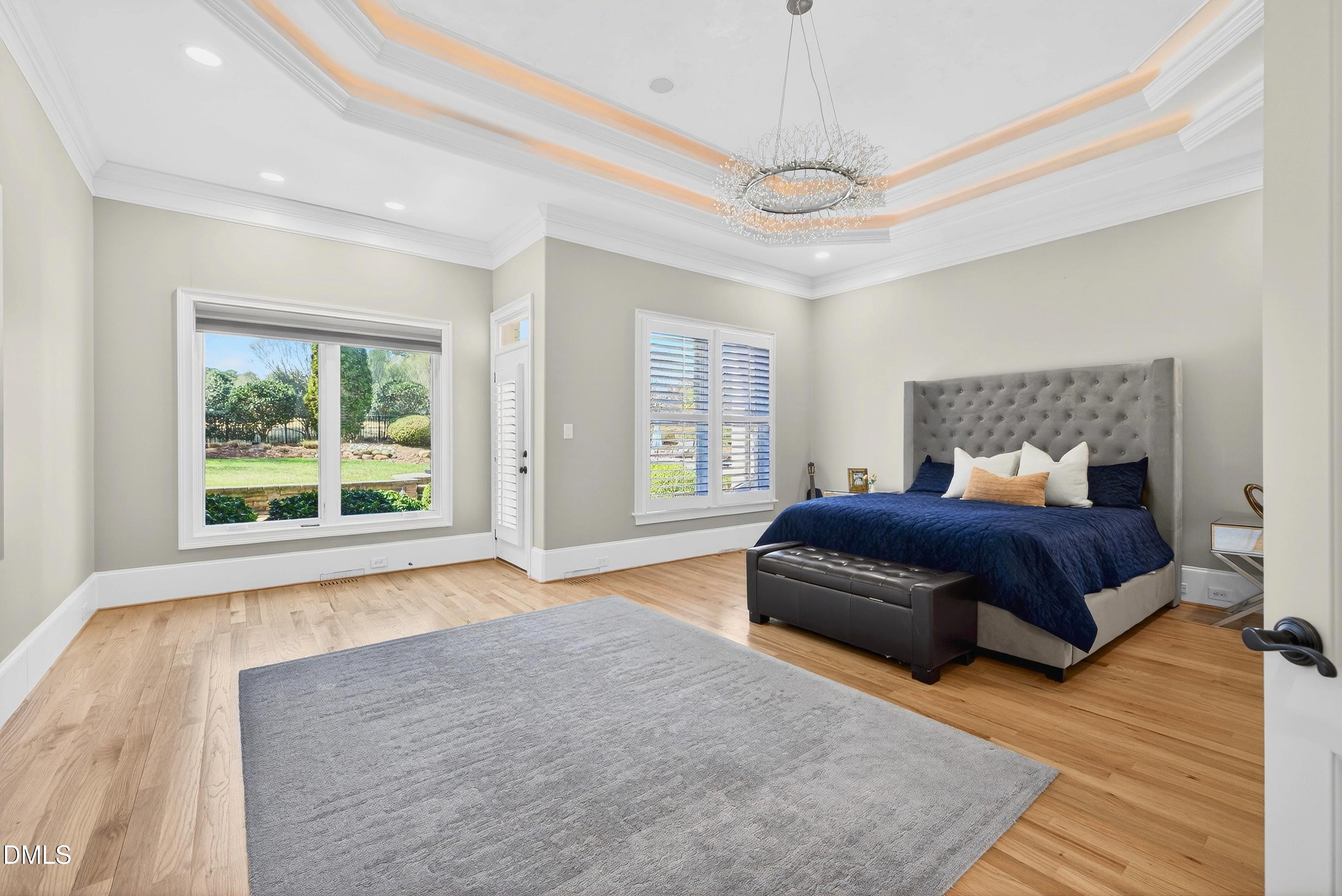 6701 Foxfire Place Raleigh, NC 27615 - Photo 25 of 67 a bedroom with a large bed and a window