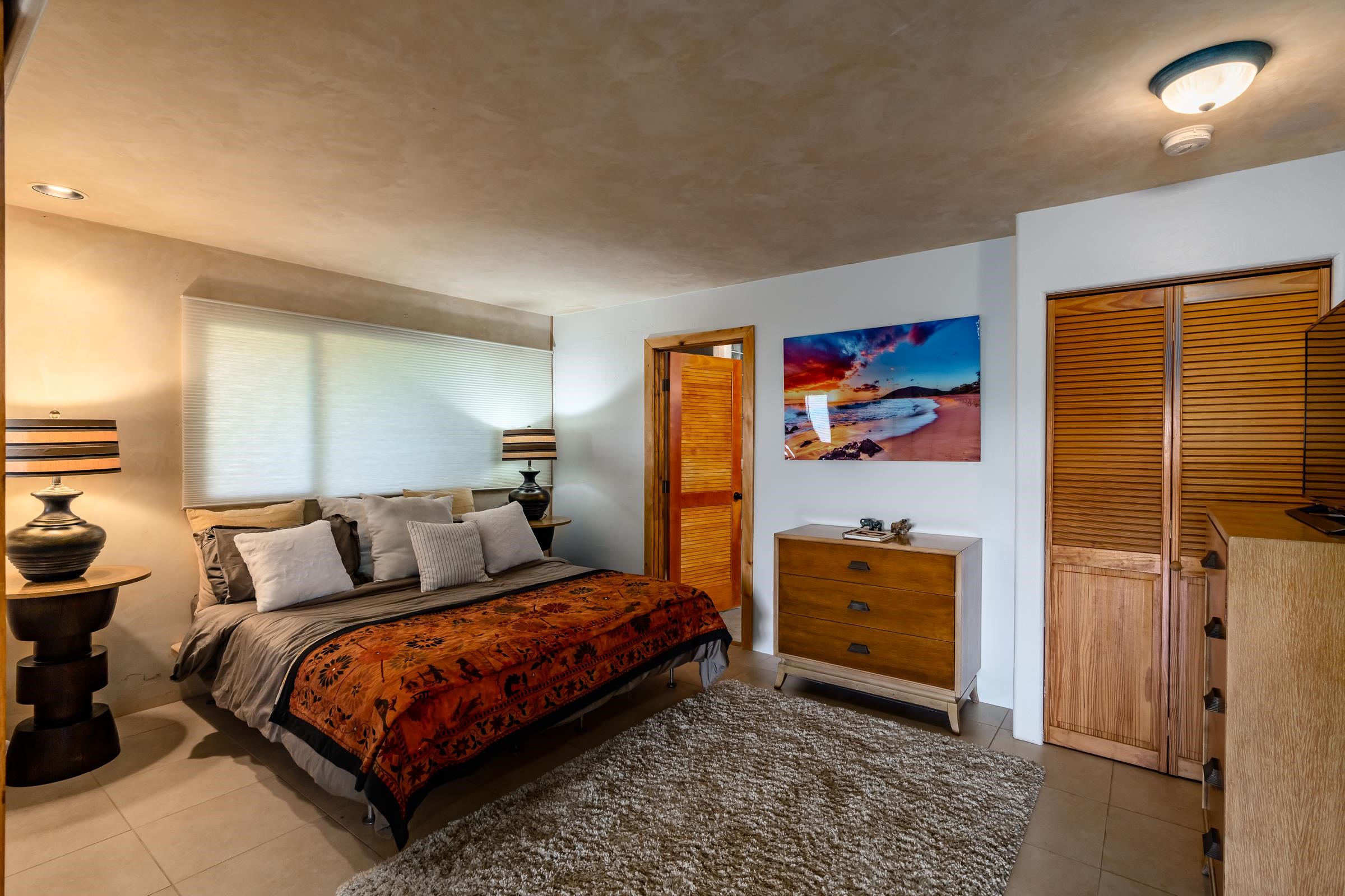 207 Uakoko Place Haiku, HI 96708 - Photo 16 of 30 a bedroom with a bed and dresser