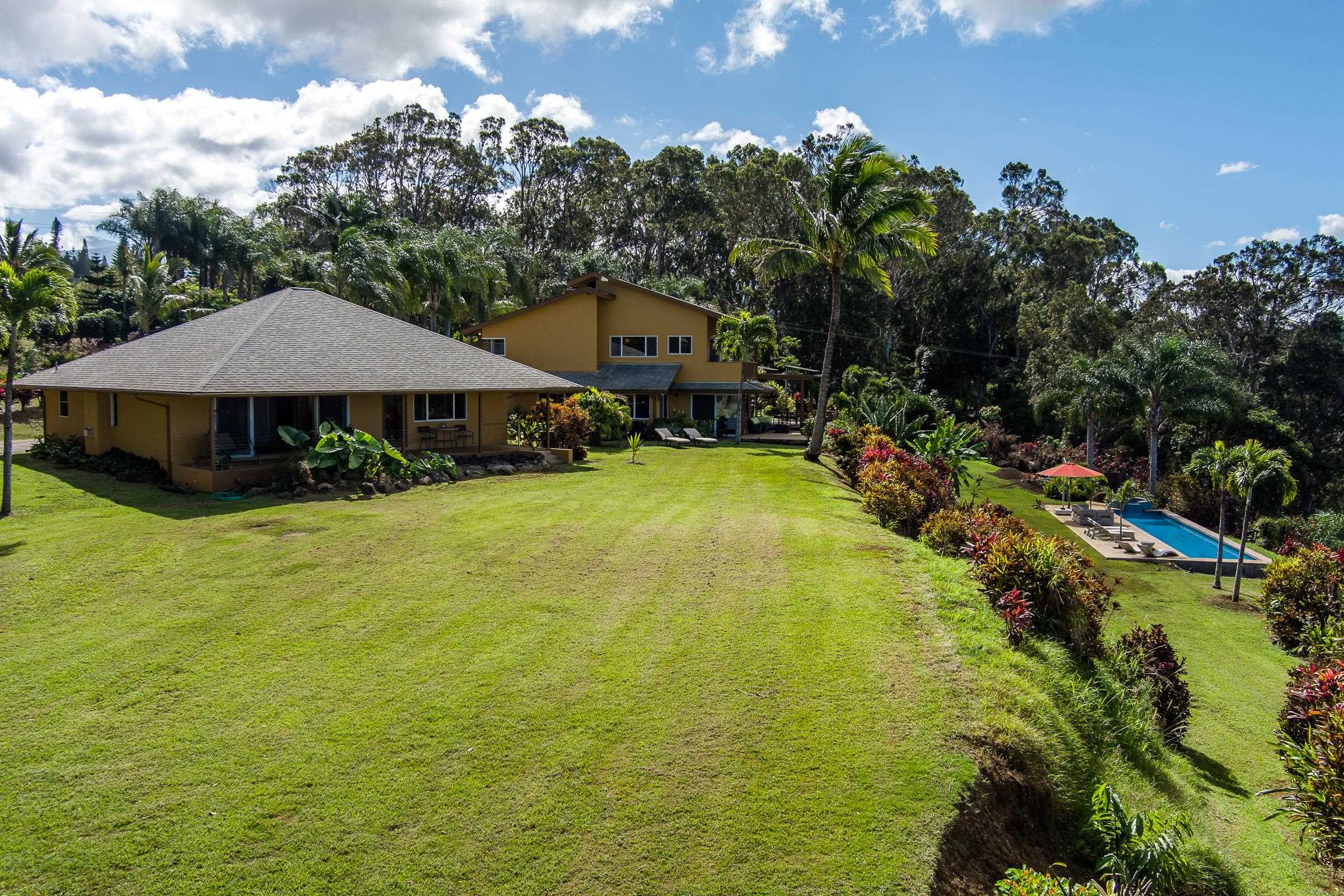207 Uakoko Place Haiku, HI 96708 - Photo 18 of 30 a view of a house with swimming pool and porch with furniture