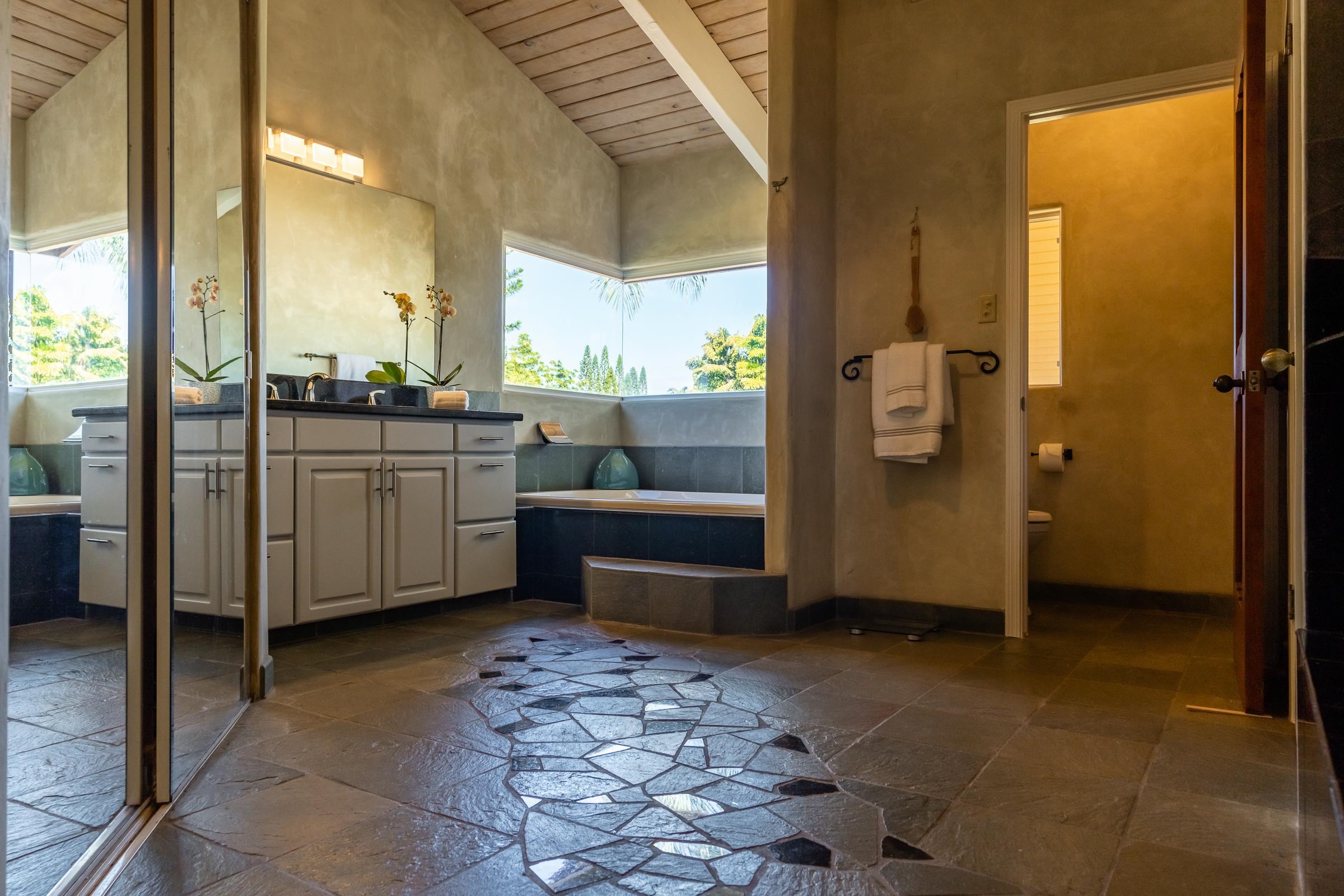 207 Uakoko Place Haiku, HI 96708 - Photo 10 of 30 a bathroom with a glass door shower and a sink