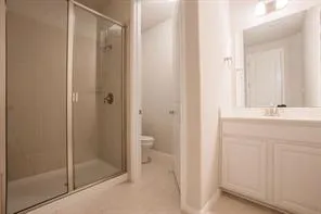 a bathroom with a shower and a sink
