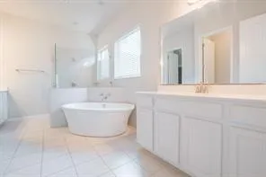 a bathroom with a bathtub and a sink