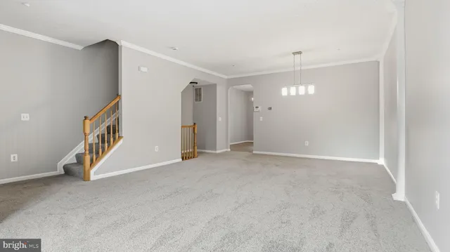 a view of an empty room with a bathroom