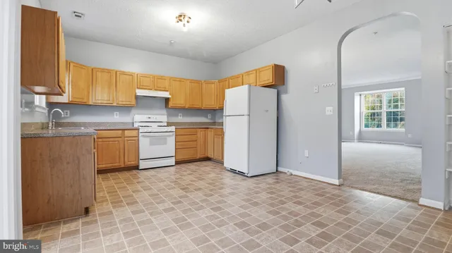 a view of a bedroom with closet and utility