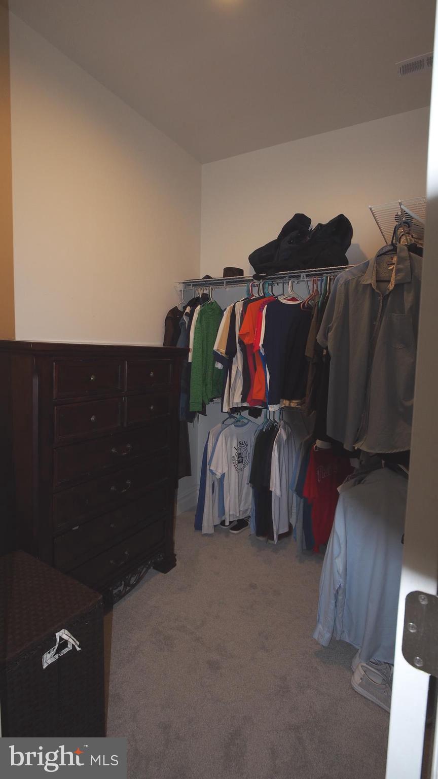 274 Pineville Road Newtown, PA 18940 - Photo 46 of 112 a view of walk in closet with clothes and shoes