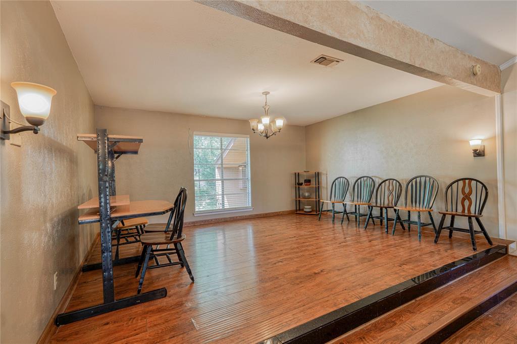 1006 Rikkity Lane Mount Pleasant, TX 75455 - Photo 6 of 39 a view of a dining room with furniture and wooden floor