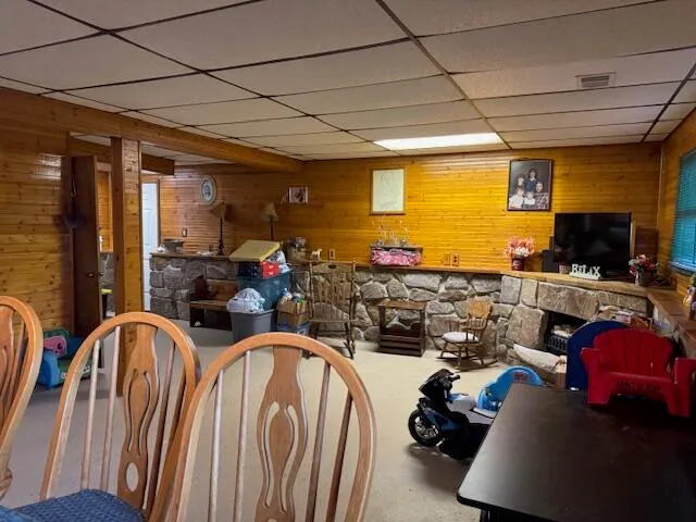 a room with lots of furniture and a flat screen tv