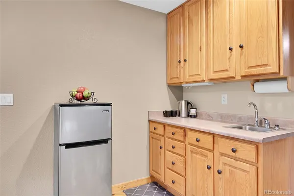 a kitchen with cabinets and appliances