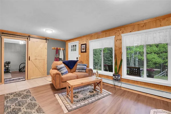 a living room with furniture and a rug