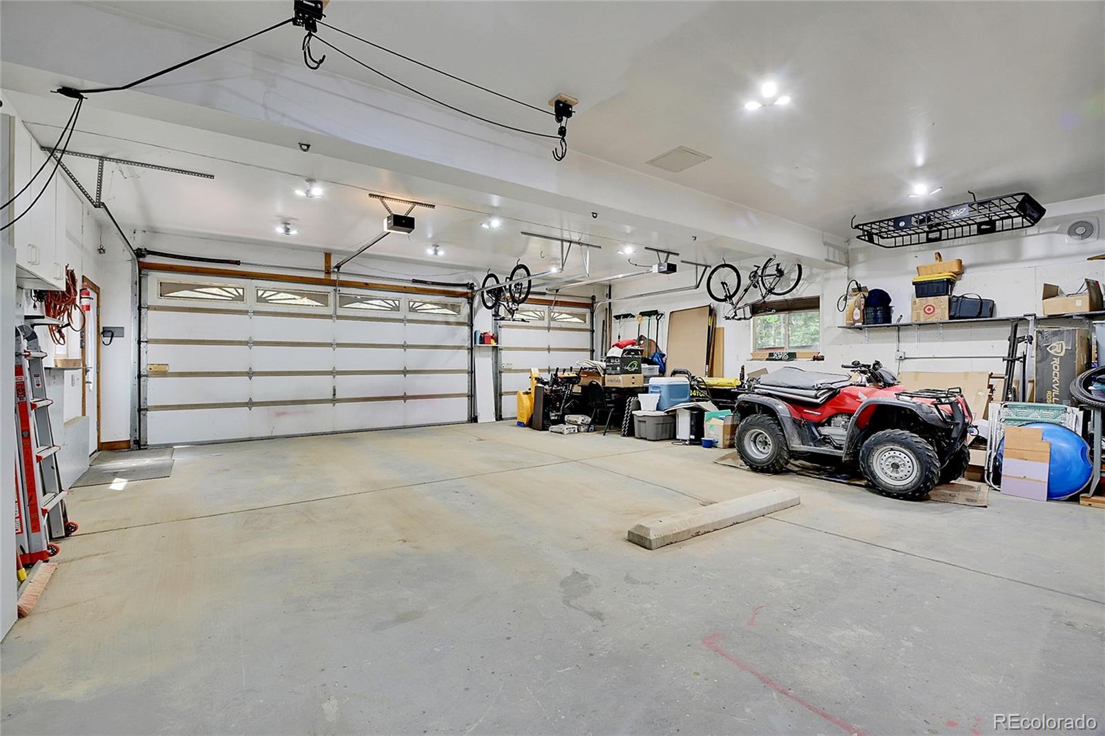 11182 Barney Gulch Road Conifer, CO 80433 - Photo 32 of 50 a view of parking garage with cars