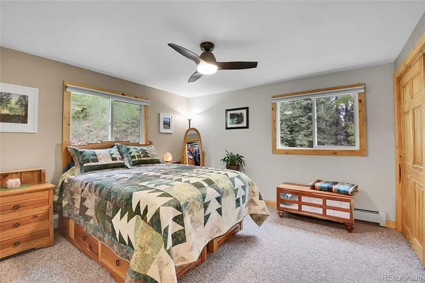 a bed room with a bed and a window