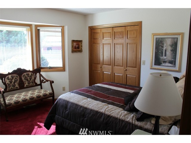 2127 Rice Road Chehalis, WA 98532 - Photo 15 of 25 a bedroom with a bed window and couch