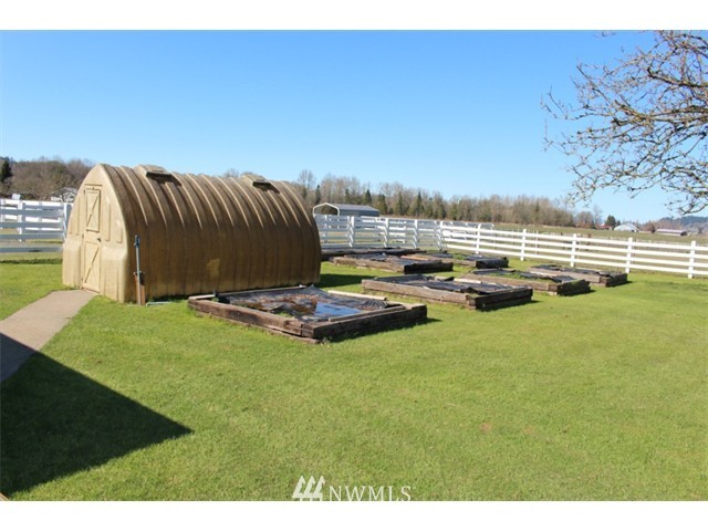 2127 Rice Road Chehalis, WA 98532 - Photo 22 of 25 a view of a lake with lawn chairs