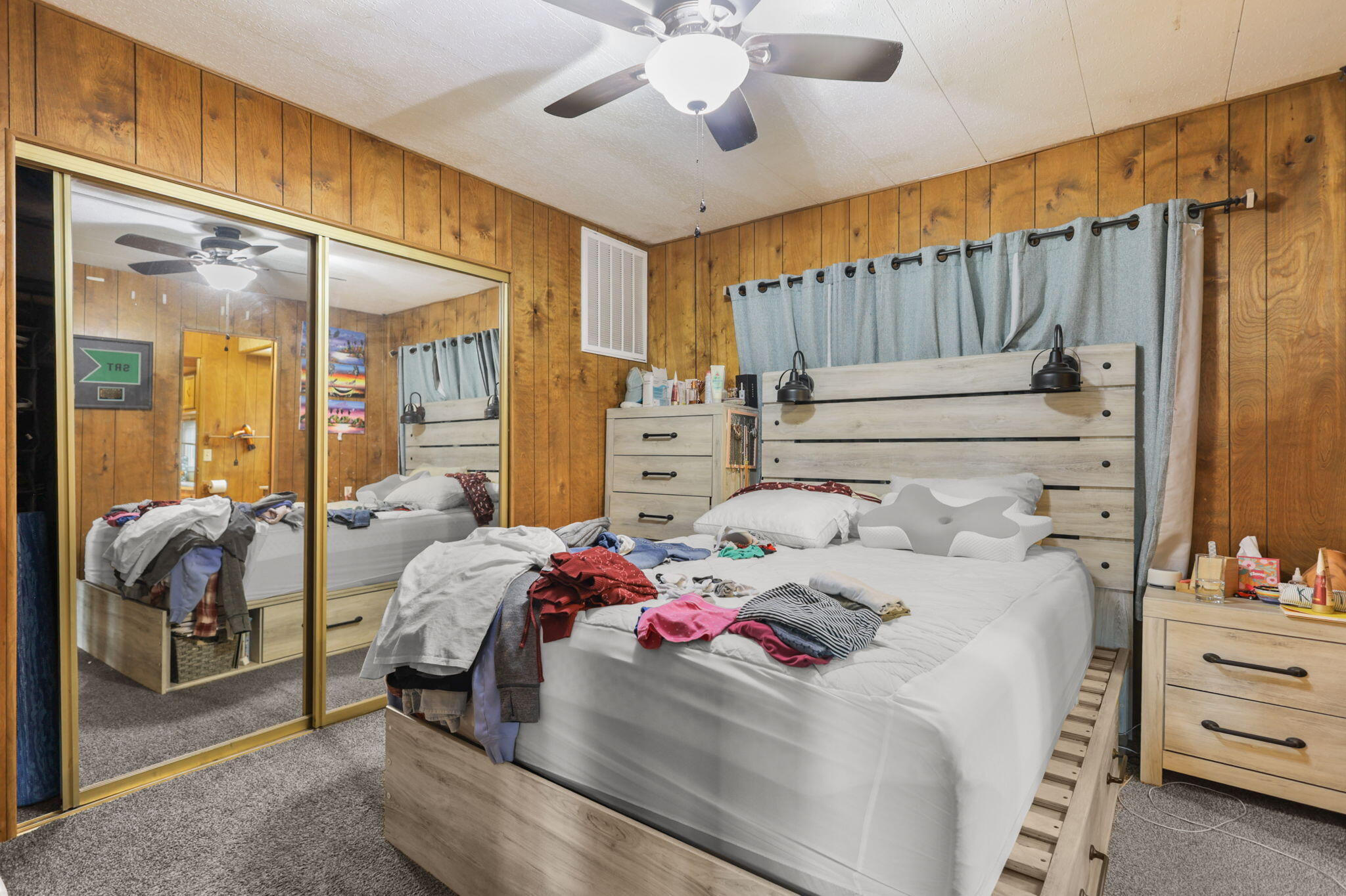 5722 Happy Valley Road Anderson, CA 96007 - Photo 15 of 29 a bedroom with a bed and a mirror