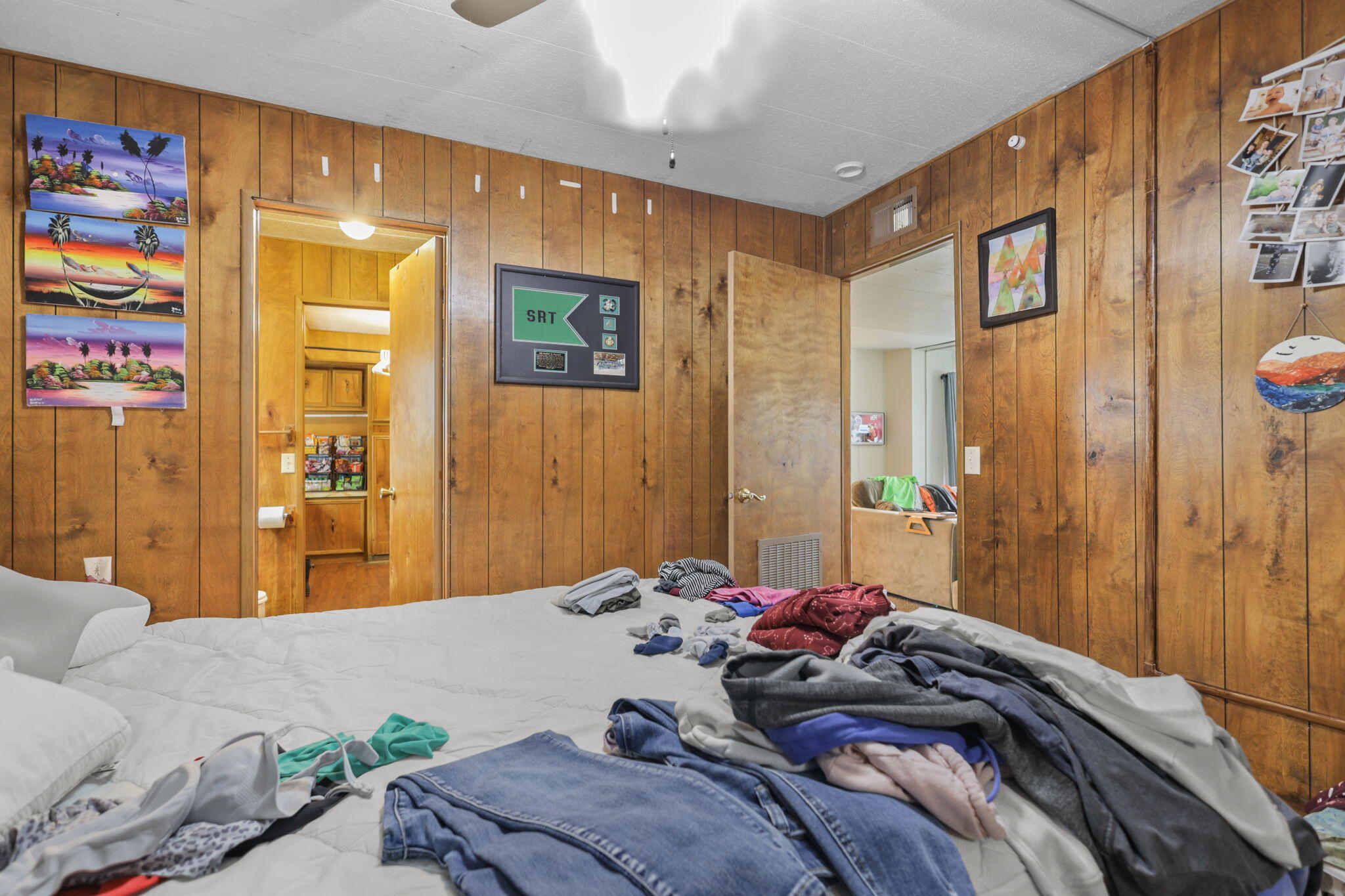 5722 Happy Valley Road Anderson, CA 96007 - Photo 16 of 29 a bed room with a bed and a painting