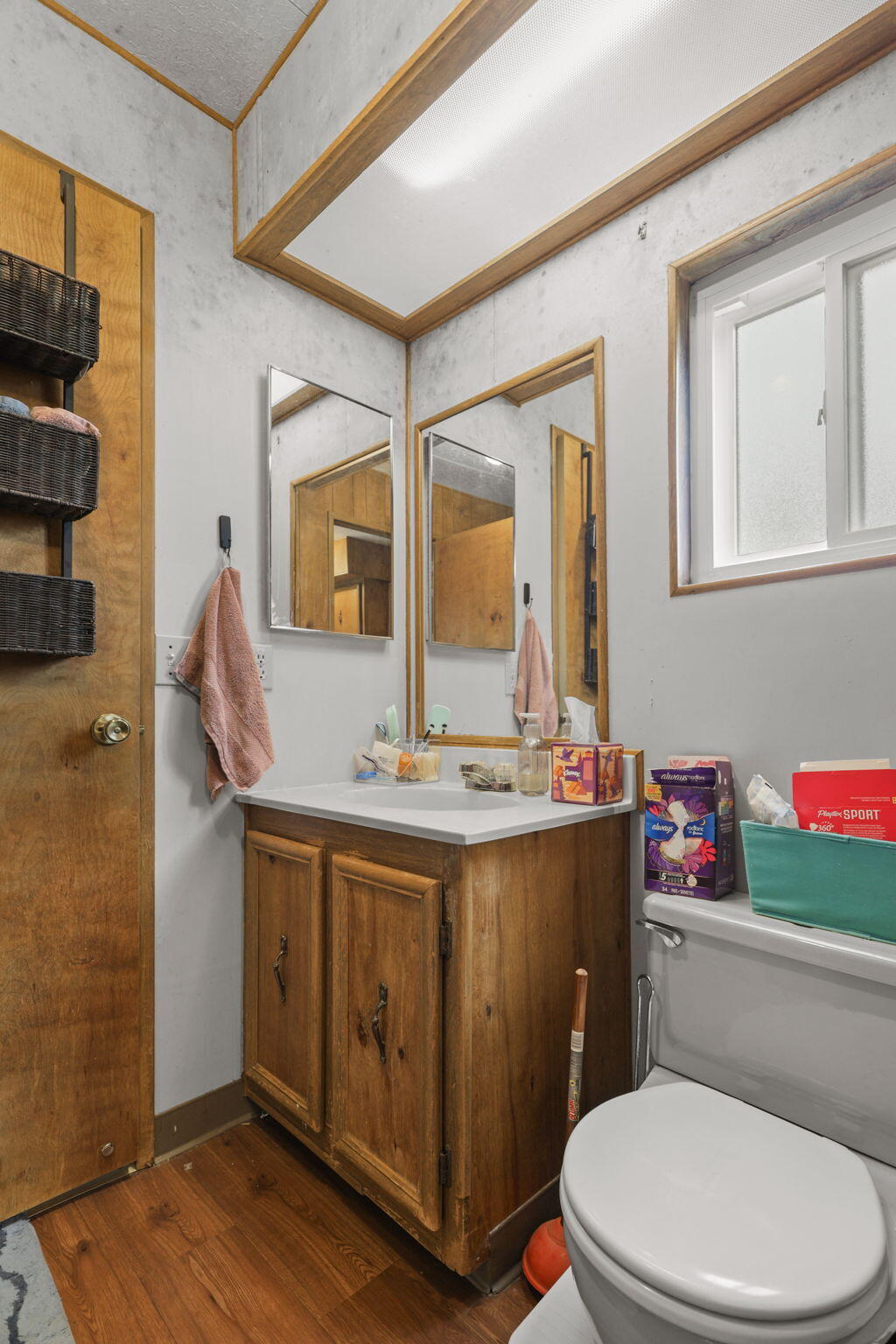5722 Happy Valley Road Anderson, CA 96007 - Photo 17 of 29 a bathroom with a toilet a sink and mirror