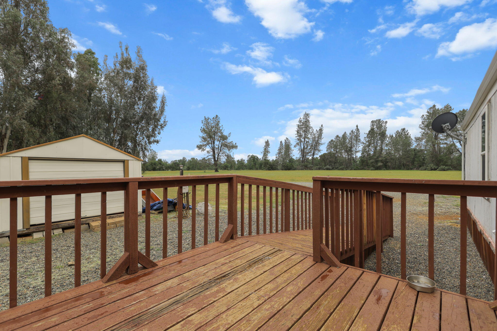 5722 Happy Valley Road Anderson, CA 96007 - Photo 21 of 29 a balcony with wooden floor and fence
