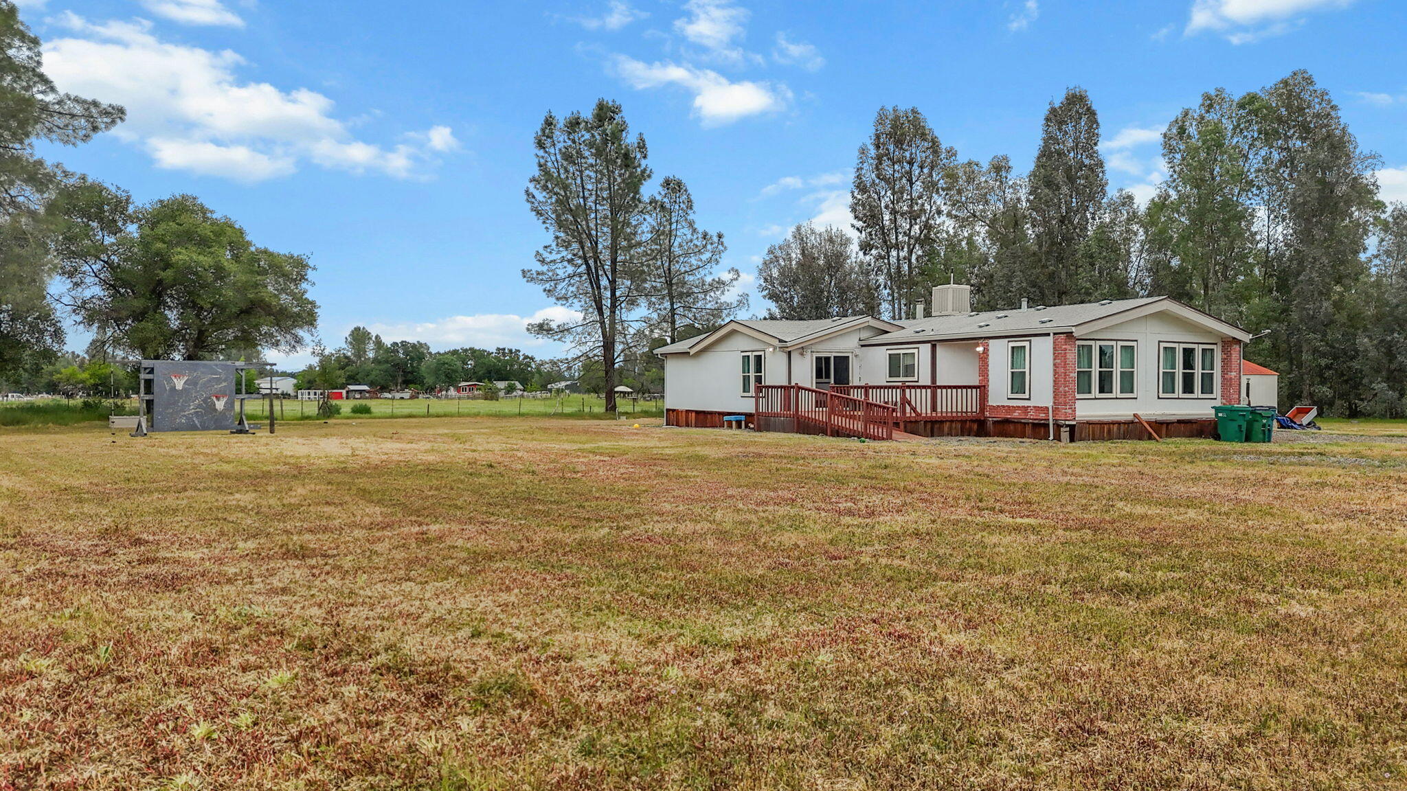 5722 Happy Valley Road Anderson, CA 96007 - Photo 23 of 29 a view of a house with outdoor space and sitting area