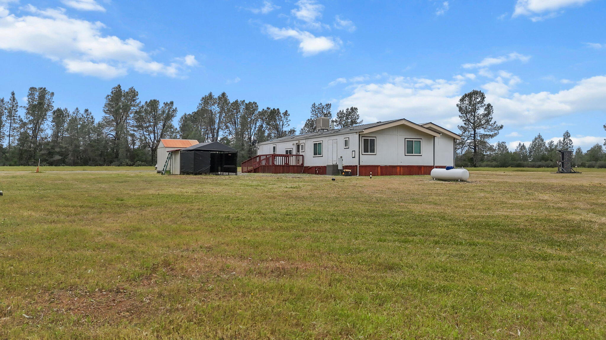 5722 Happy Valley Road Anderson, CA 96007 - Photo 24 of 29 a view of a house with a yard