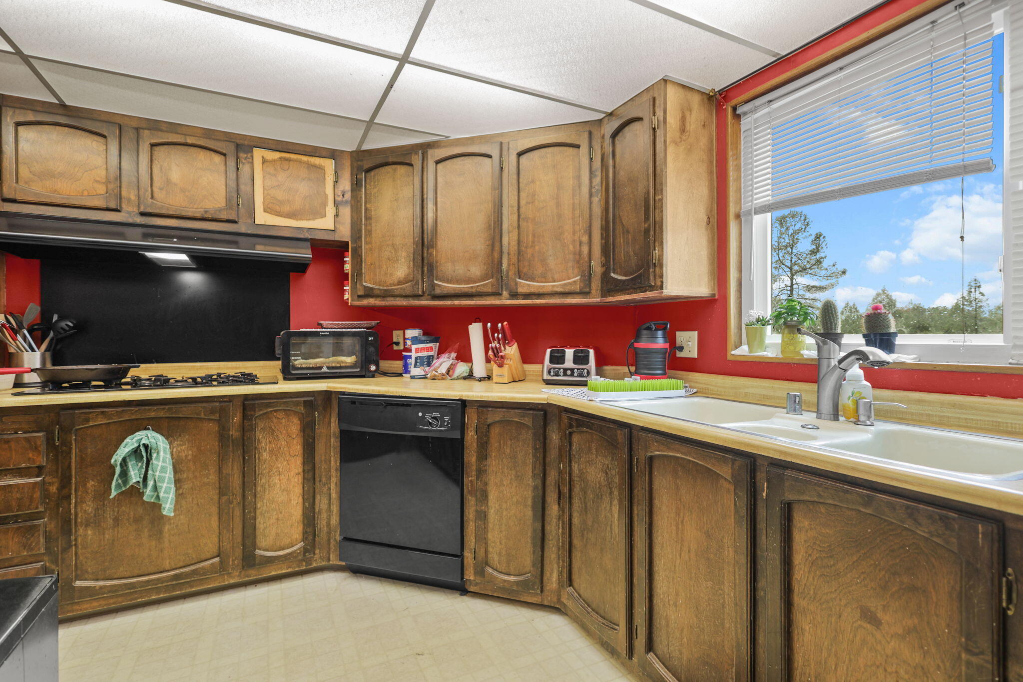 5722 Happy Valley Road Anderson, CA 96007 - Photo 6 of 29 a kitchen with a sink a stove and cabinets