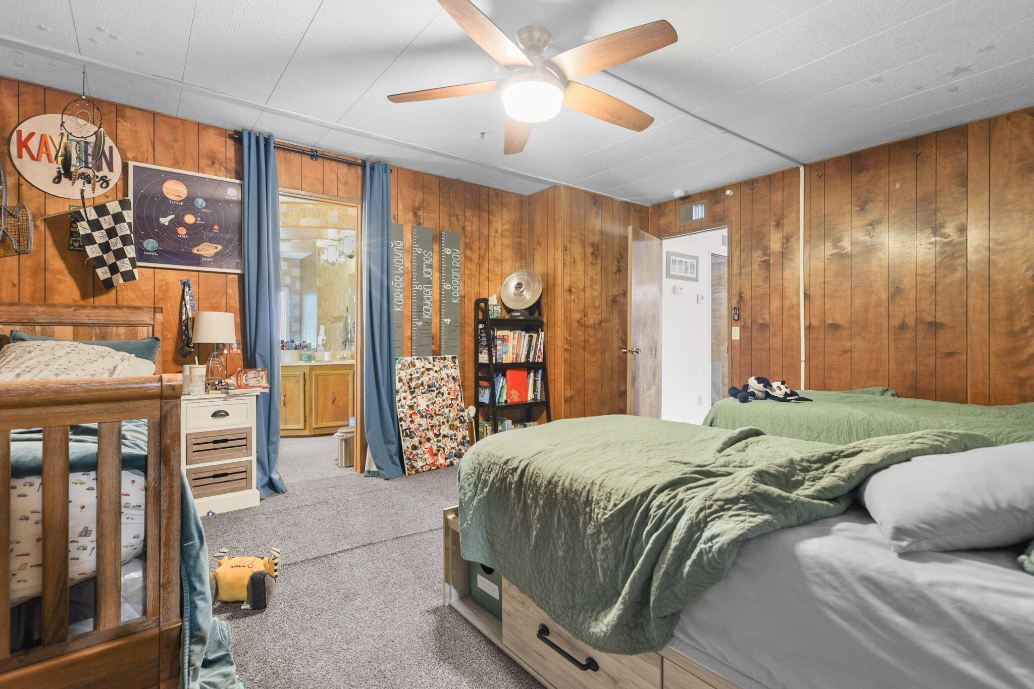 5722 Happy Valley Road Anderson, CA 96007 - Photo 10 of 29 a bedroom with a large bed and a chandelier