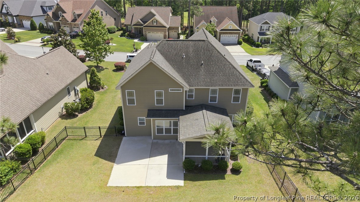 886 Micahs Way North Spring Lake, NC 28390 - Photo 41 of 50 an aerial view of a house with swimming pool and sitting area
