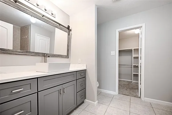 a spacious bathroom with a bathtub and a sink
