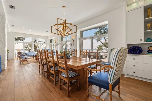 a view of a dining room with furniture window and wooden floor