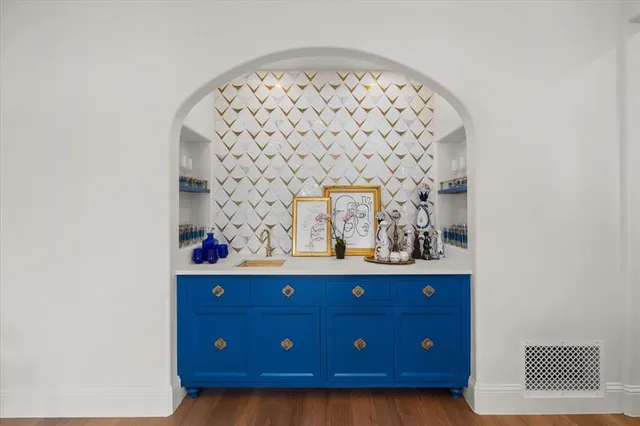a view of wooden floor and a shelf