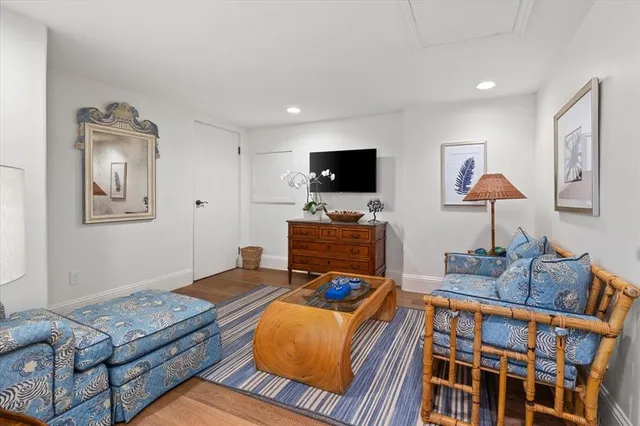 a bedroom with furniture and a flat screen tv
