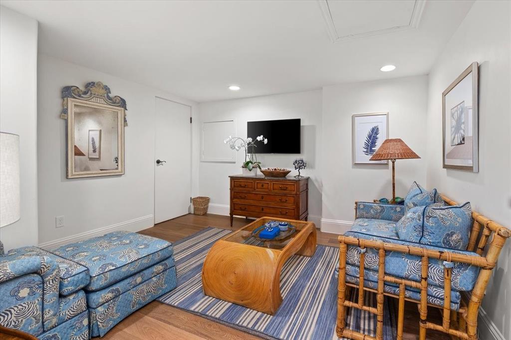 9308 Lechner Road Fort Worth, TX 76179 - Photo 24 of 40 a bedroom with furniture and a flat screen tv