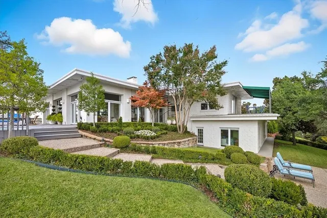 a view of house with yard and green space
