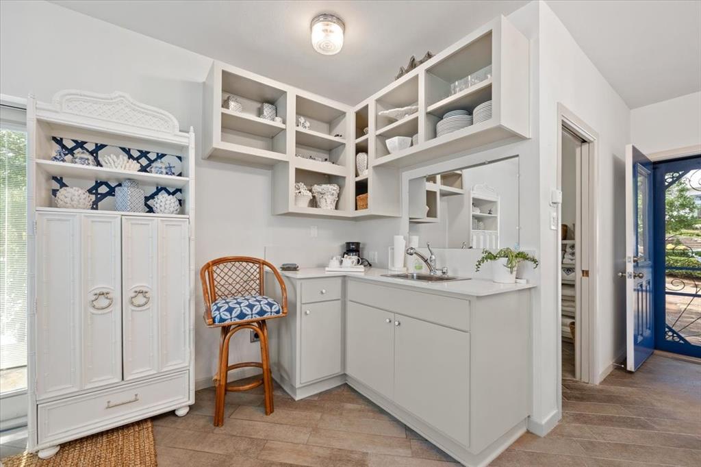 9308 Lechner Road Fort Worth, TX 76179 - Photo 35 of 40 a view of cabinets with wooden floor and windows