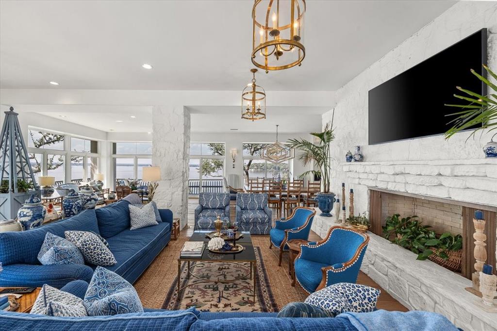 9308 Lechner Road Fort Worth, TX 76179 - Photo 8 of 40 a living room with fireplace furniture and a flat screen tv