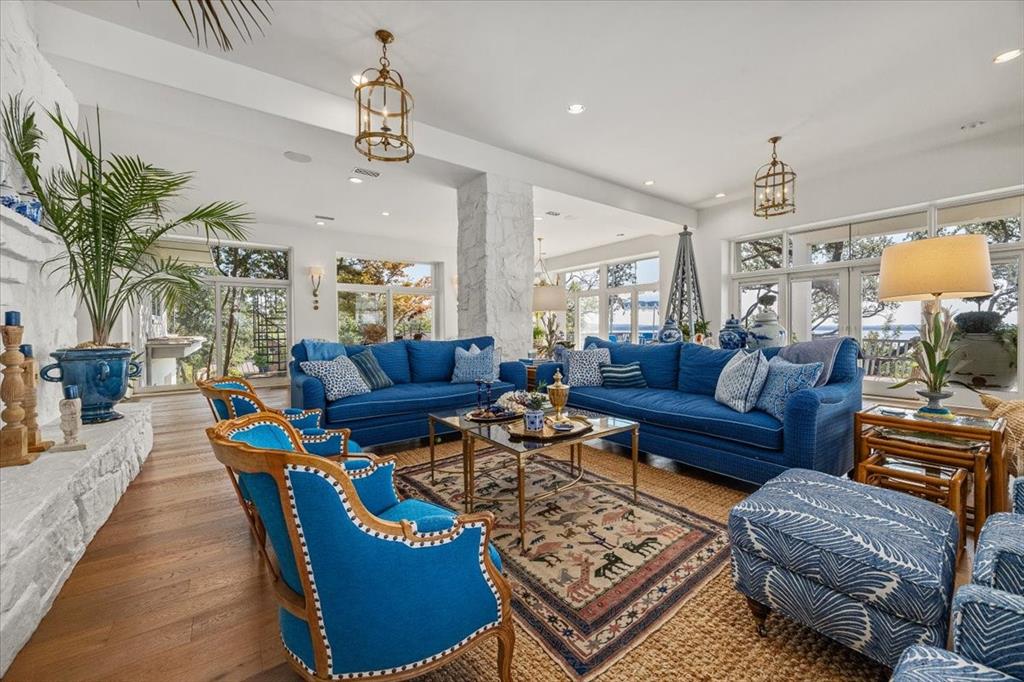 9308 Lechner Road Fort Worth, TX 76179 - Photo 9 of 40 a living room with furniture and a chandelier