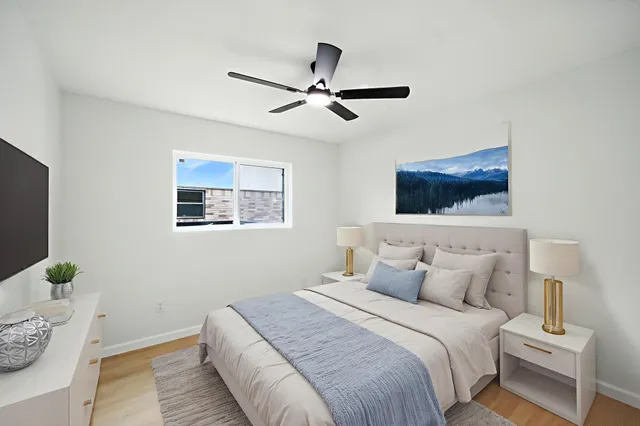 a bedroom with a bed and a window