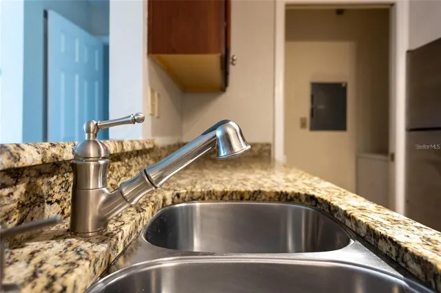 a view of a kitchen cabinets and wooden floor