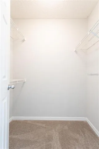 a bathroom with a granite countertop sink toilet mirror and shower