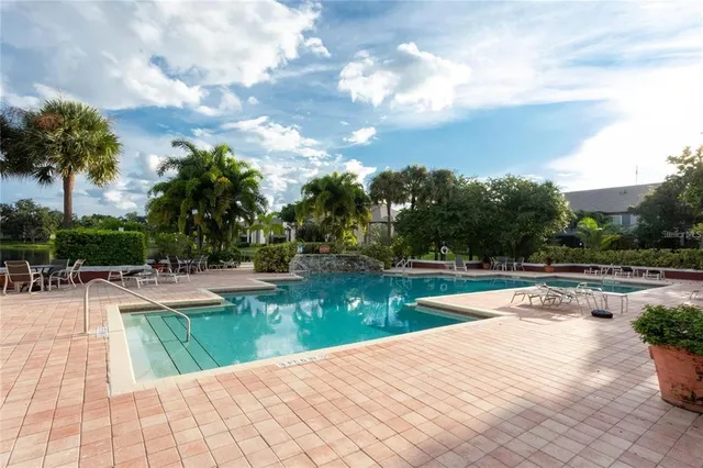a view of a swimming pool with a patio