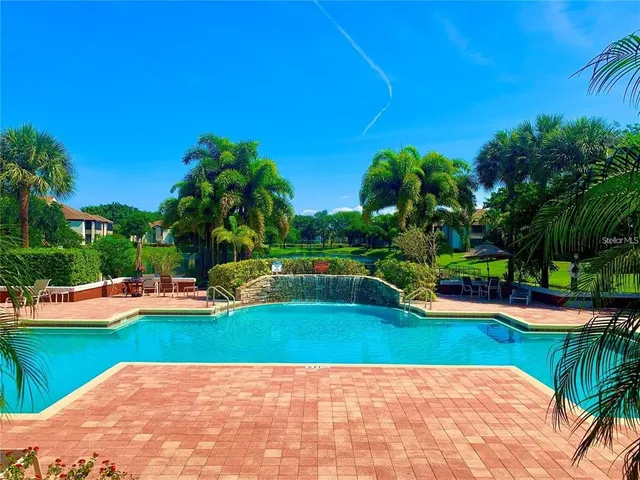 a outdoor dining space with furniture and garden view