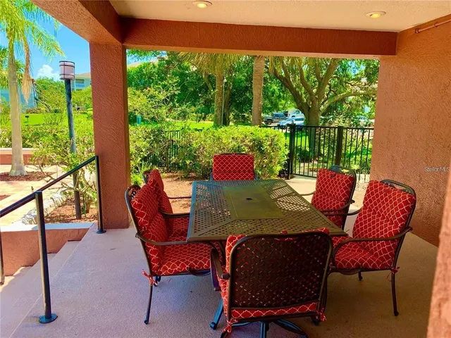 an aerial view of a house with a garden and lake view
