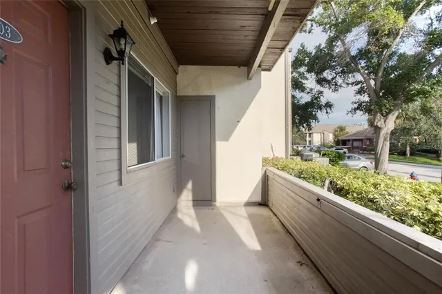 a view of a kitchen with wooden floor and a sink