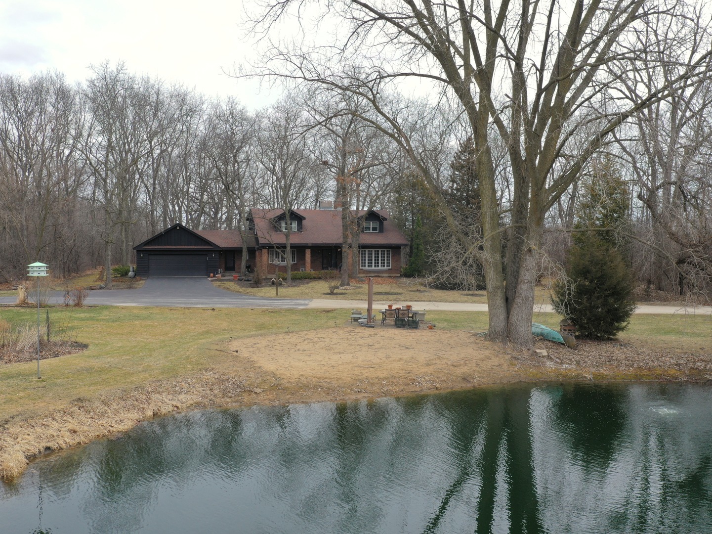 18238 West Gages Lake Road Grayslake, IL 60030 - Photo 6 of 19 a backyard of a house with table and chairs