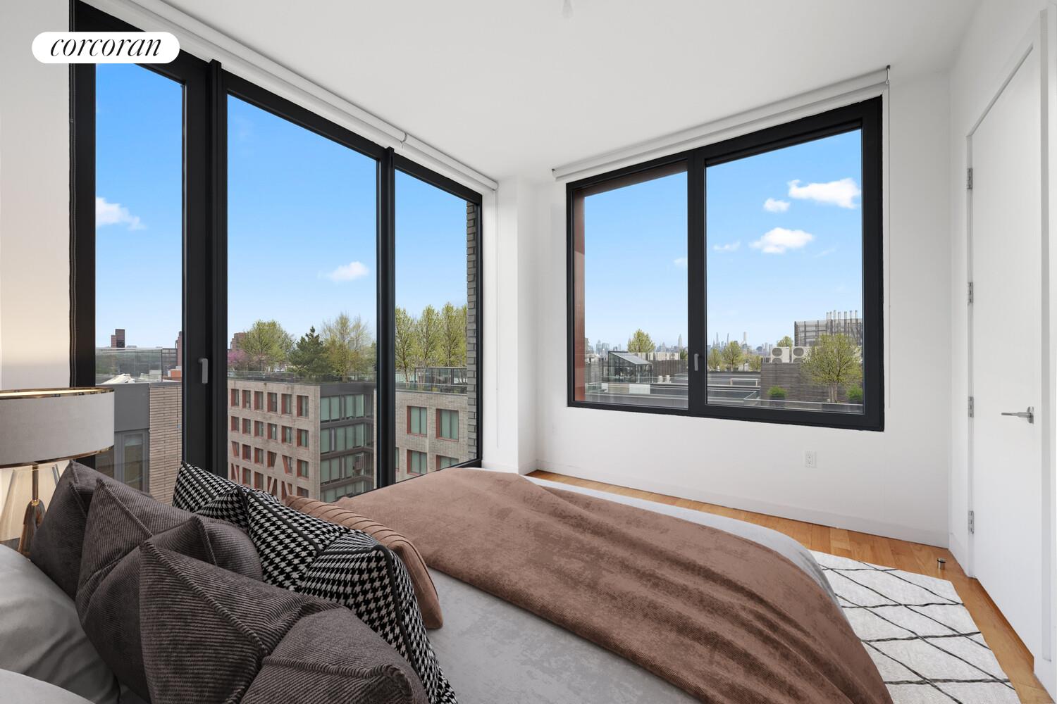 54 Noll Street, Unit 361 Brooklyn, NY 11206 - Photo 3 of 26 a bedroom with a large bed and a large window with outer view