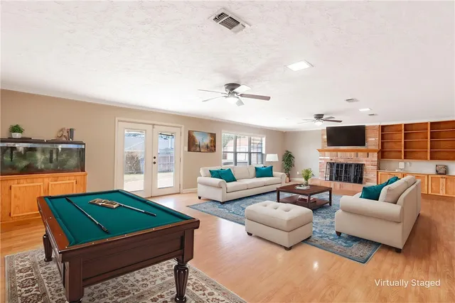 a living room with furniture rug and window