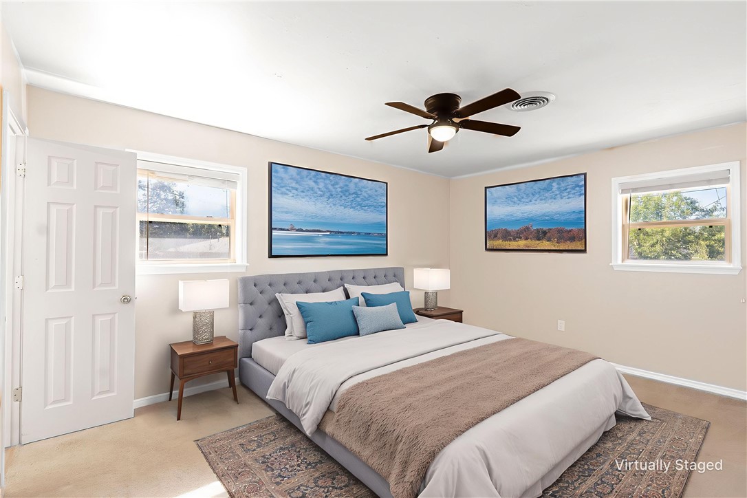 2316 Kent Street Bryan, TX 77802 - Photo 15 of 31 a bedroom with a large bed and a window