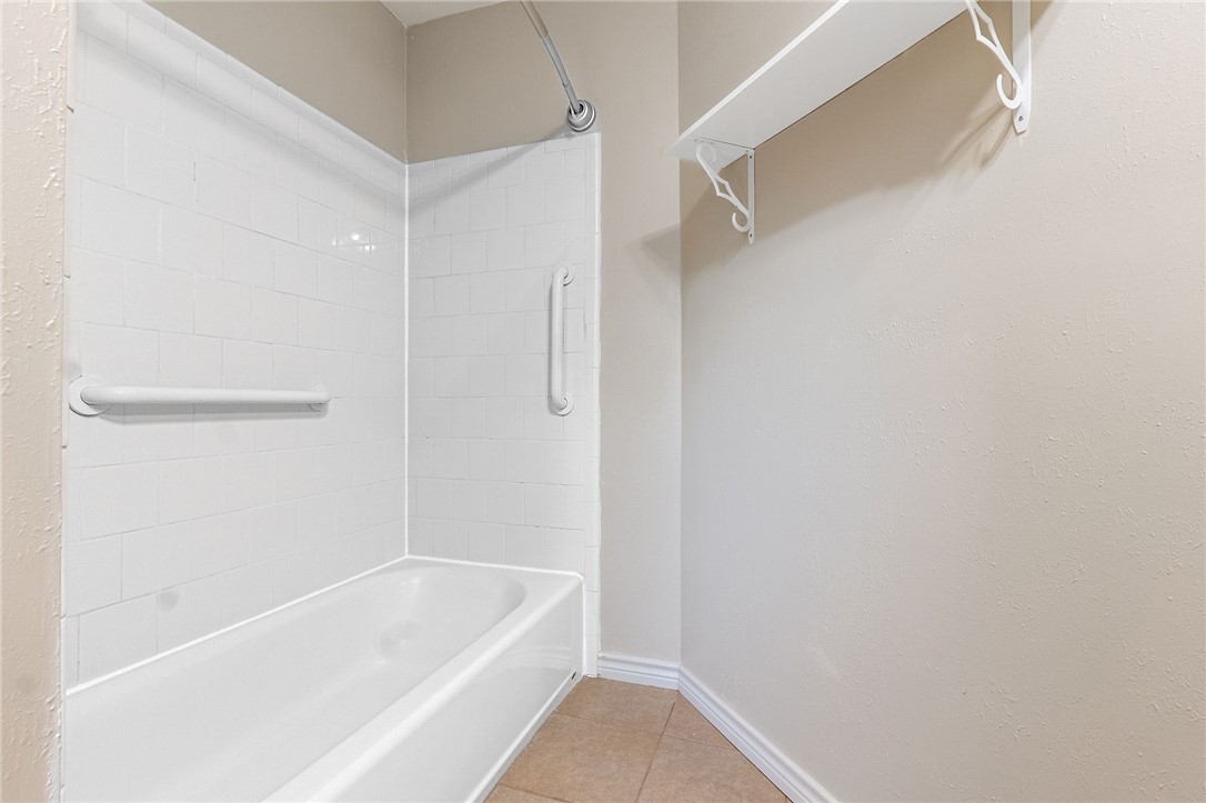 2316 Kent Street Bryan, TX 77802 - Photo 18 of 31 a bathroom with a tub and shower
