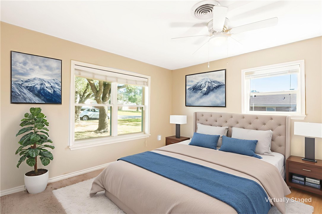 2316 Kent Street Bryan, TX 77802 - Photo 19 of 31 a bedroom with a large bed and a window