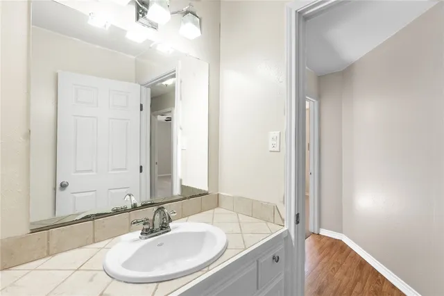 a bathroom with a bathtub and a sink